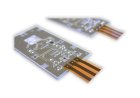 Präzise Lötverbindung einer Flexfolie auf einer Aluminiumoxid-Leiterplatte mittels Bügellötung.